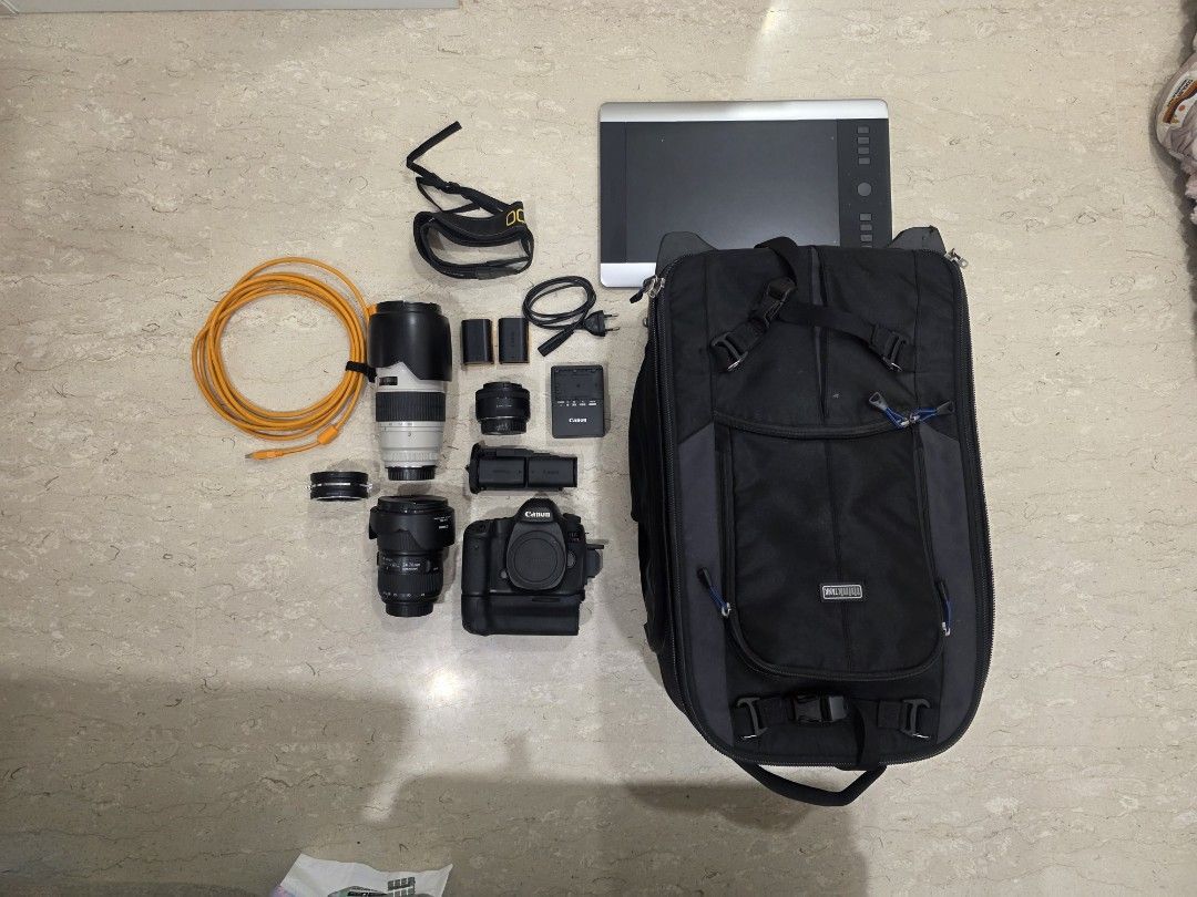 Camera set (Category: Cameras) located in Singapore. Submitted by seanxie (Listing ID 1468287033, Image 1). Description: - Canon 5DsR body with battery grip - Canon 24-70mm lens usm 1 f2.8 - Canon 70-200mm lens usm 1 f2.8 - Canon 50mm pancake lens f2.8 - 4 batteries and charger - 2 SD cards - Think Tank camera roller and bagpack - Wacom Drawing tablet, cables included - Selling as a complete bundle only - All in great working condition.