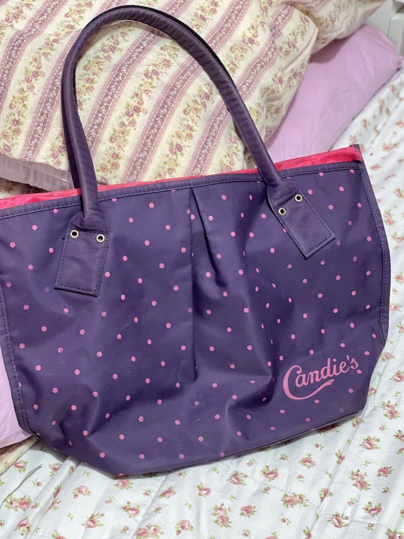 Candie's Purple Polka Dot Tote Bag (Category: Tote Bags) located in Pasig City. Submitted by morilove (Listing ID 1468306781, Image 1). Description: - Brand: Candie's - Design: Purple with all-over pink polka dots and metal hardware details - Dimensions: Roughly 16 inches across - Interior: Bright pink lining with a spacious main compartment and an inner slip pocket - Closure & Accents: Zipper closure with a cute star zipper pull and brand logo n