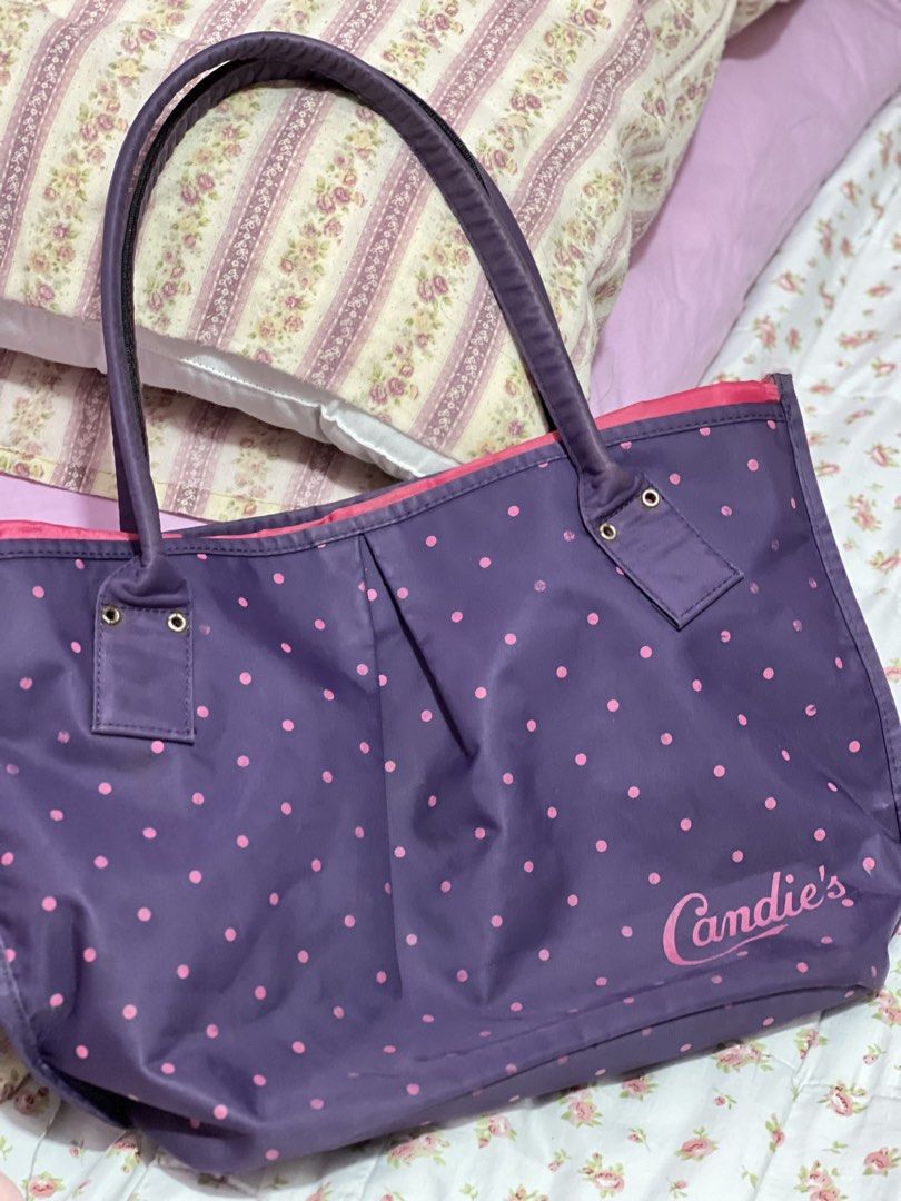 Candie's Purple Polka Dot Tote Bag (Category: Tote Bags) located in Pasig City. Submitted by morilove (Listing ID 1468306781, Image 2). Description: - Brand: Candie's - Design: Purple with all-over pink polka dots and metal hardware details - Dimensions: Roughly 16 inches across - Interior: Bright pink lining with a spacious main compartment and an inner slip pocket - Closure & Accents: Zipper closure with a cute star zipper pull and brand logo n