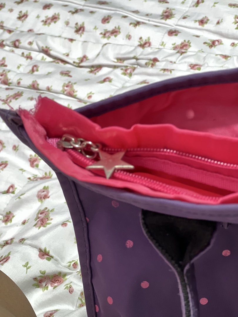 Candie's Purple Polka Dot Tote Bag (Category: Tote Bags) located in Pasig City. Submitted by morilove (Listing ID 1468306781, Image 3). Description: - Brand: Candie's - Design: Purple with all-over pink polka dots and metal hardware details - Dimensions: Roughly 16 inches across - Interior: Bright pink lining with a spacious main compartment and an inner slip pocket - Closure & Accents: Zipper closure with a cute star zipper pull and brand logo n