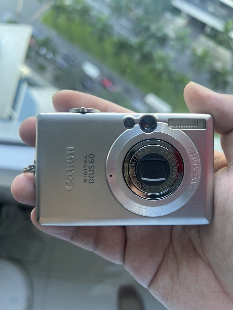 Canon Digital IXUS 60 Compact Camera (Category: Cameras) located in Manila. Submitted by puredolphin.8fdf1e (Listing ID 1468287009, Image 1). Description: - Model: Canon Digital IXUS 60 Compact Camera (Silver) - Resolution: 6.0 Megapixels with 3x optical zoom lens - Display: Working LCD screen - Features: Built-in flash on the front - Condition: Compact metal body with minor surface scratches from normal handling - Note: Battery and memory card s