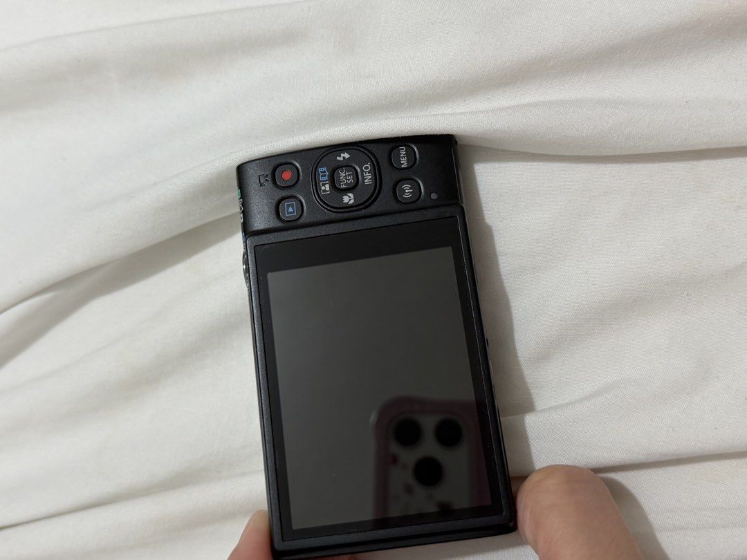 Canon IXUS 285 HS A Digital Camera (Category: Cameras) located in Bacoor. Submitted by everything_etc. (Listing ID 1468461377, Image 3). Description: - Model: Canon IXUS 285 HS (Black) - Condition: Fully working, normal handling marks on the body - Lens: 12x optical zoom for versatile shooting - Connectivity: Built-in Wi-Fi for easy photo transfer - Video: Full HD capability - Design: Standard button layout with rear LCD screen and bottom battery