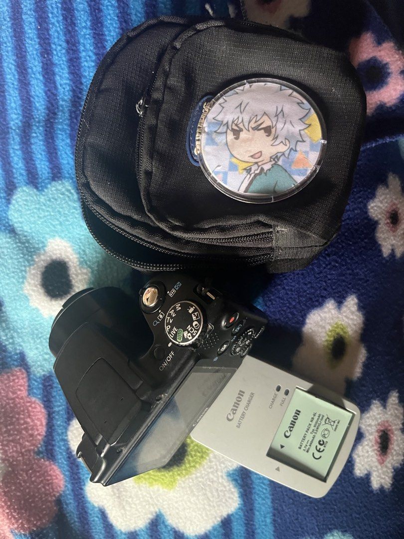 Canon PowerShot SX510 HS Digital Camera Bundle (Category: Cameras) located in Caloocan City. Submitted by r4yyyy (Listing ID 1468447846, Image 3). Description: - 30x optical zoom lens for distant subjects - Includes original battery pack and battery charger - Comes with a black camera pouch ‼️LENS DEFECT‼️ - images has a black circle border and unfocused when zooming in.