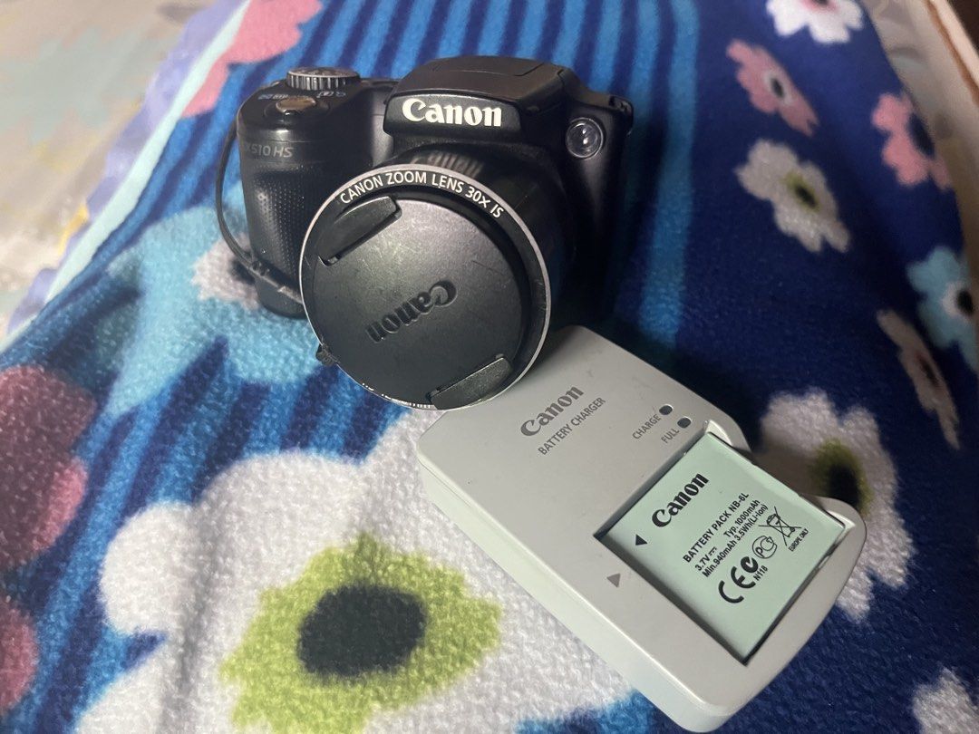 Canon PowerShot SX510 HS Digital Camera Bundle (Category: Cameras) located in Caloocan City. Submitted by r4yyyy (Listing ID 1468447846, Image 1). Description: - 30x optical zoom lens for distant subjects - Includes original battery pack and battery charger - Comes with a black camera pouch ‼️LENS DEFECT‼️ - images has a black circle border and unfocused when zooming in.