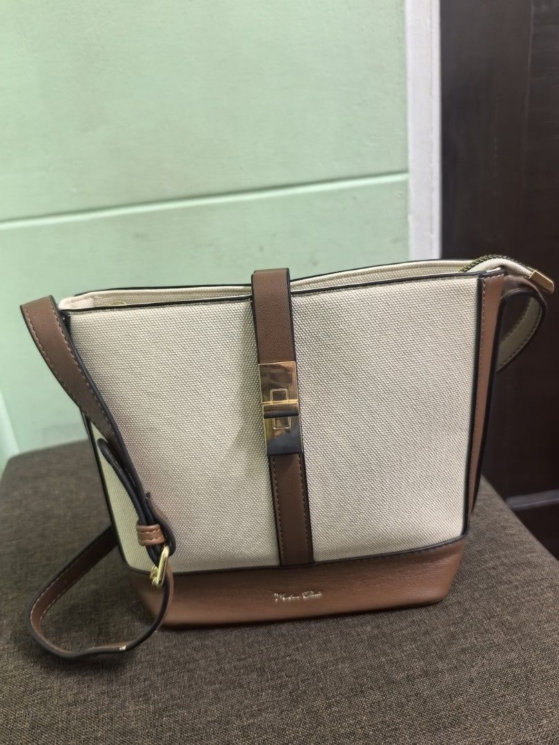 Canvass Cross body bag (Category: Cross-body Bags) located in Makati City. Submitted by decluttermom03 (Listing ID 1468358608, Image 1). Description: Bag is not used but stored for a long period of time.