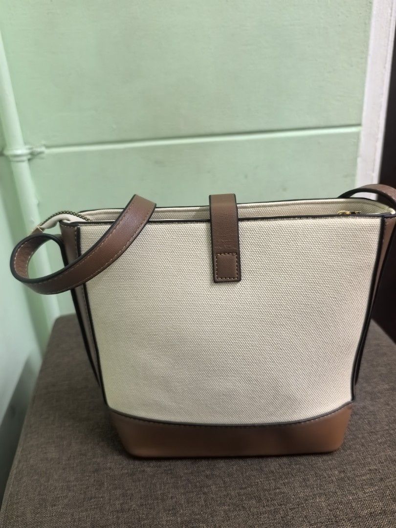 Canvass Cross body bag (Category: Cross-body Bags) located in Makati City. Submitted by decluttermom03 (Listing ID 1468358608, Image 3). Description: Bag is not used but stored for a long period of time.