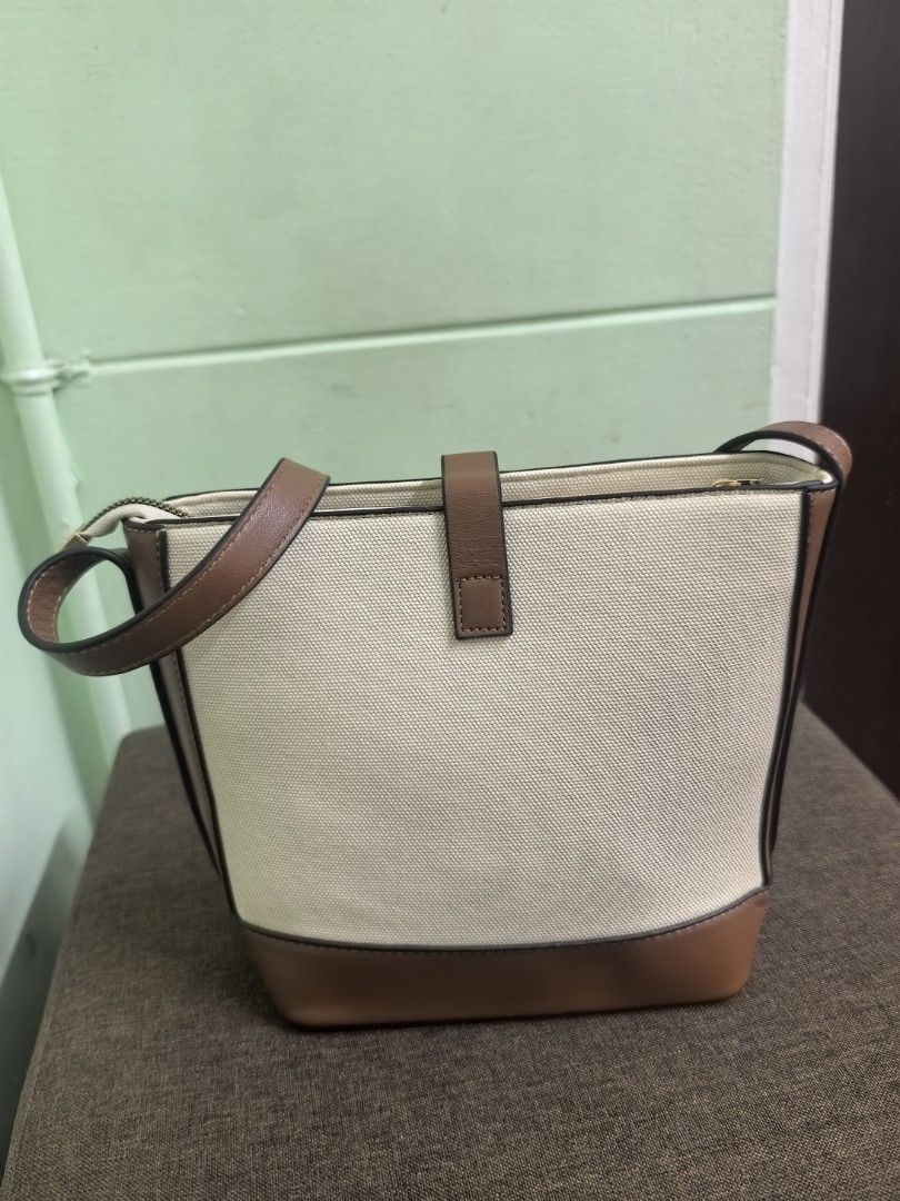 Canvass Cross body bag (Category: Cross-body Bags) located in Makati City. Submitted by decluttermom03 (Listing ID 1468358608, Image 2). Description: Bag is not used but stored for a long period of time.