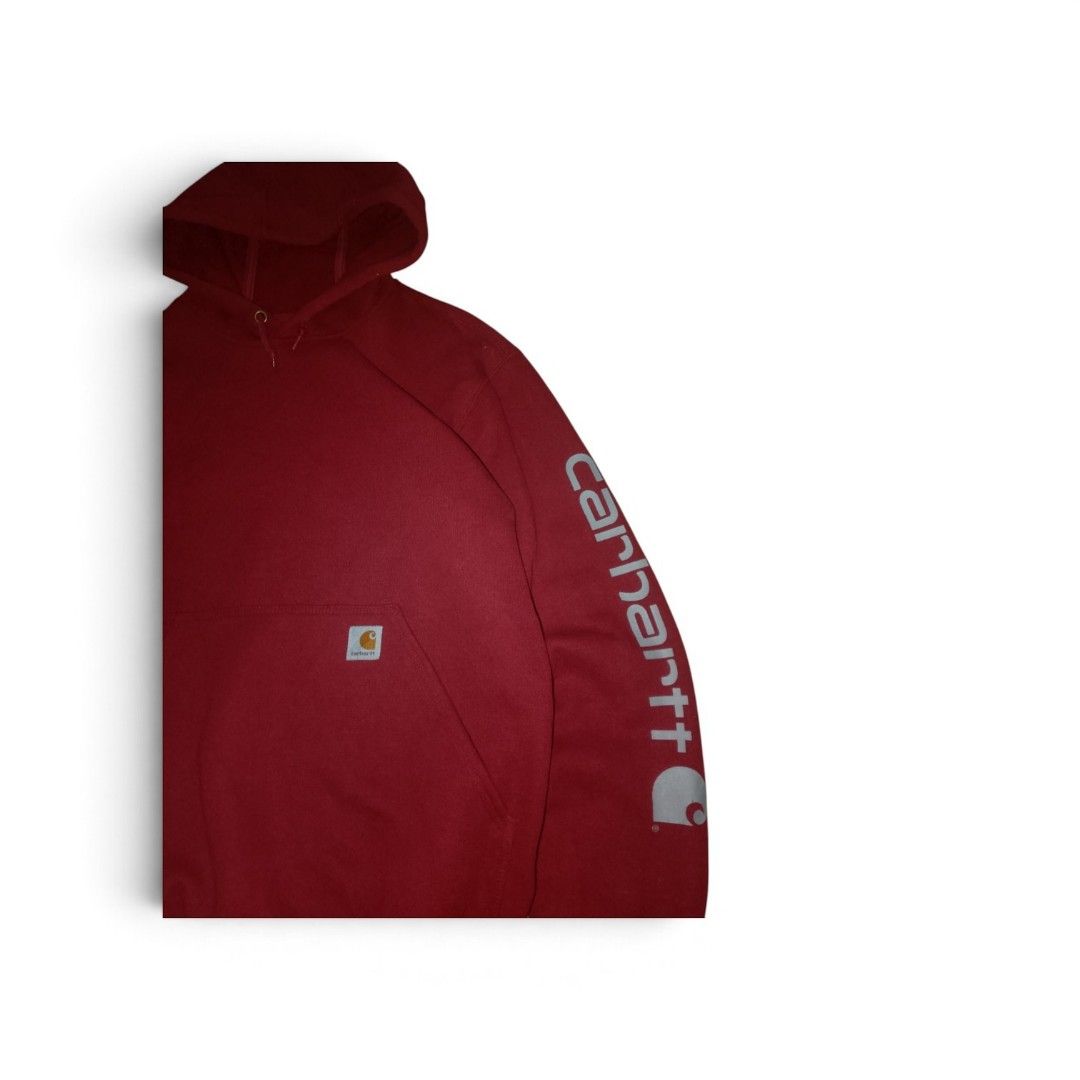 Carhartt Red Sleeve Logo Pullover Hoodie Size S (Category: Hoodies) located in Bacolod City. Submitted by rodzthrift (Listing ID 1468323472, Image 2). Description: - Brand: Carhartt - Style: Pullover hoodie with adjustable drawstring hood and front pouch pocket - Color: Deep red - Size: S Regular - Material: 50% cotton, 50% polyester (warm, heavyweight fabric) - Details: Bold silver Carhartt lettering on the left sleeve and signature logo patch o