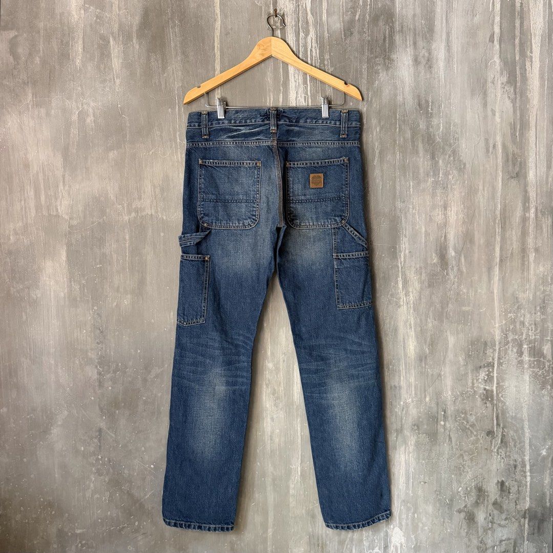 Carhartt WIP Heart Leather Patch Button-Fly Denim Carpenter Jeans (Category: Jeans) located in Puerto Princesa. Submitted by terdsthrift (Listing ID 1468392140, Image 1). Description: Carhartt WIP Heart Leather Patch Button-Fly Carpenter Jeans Waist: 32-34 Length: 41.5 Thigh: 11.5 Hem: 7.5 In Excellent Condition / No Issue Color Rate: 10/10 - Brand: Carhartt - Style: Carpenter jeans / Straight leg fit - Color/Wash: Classic blue with broken-in fad