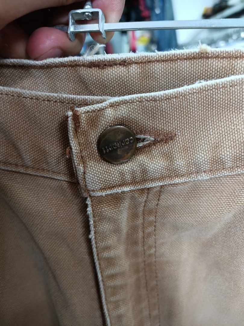 Carhartt Work in Progress Tan Duck Canvas Shorts (Category: Shorts) located in Bayombong. Submitted by rheaaa00530 (Listing ID 1468300876, Image 3). Description: - Brand: Carhartt - Material: Heavy-duty cotton canvas - Color: Tan - Features: Front slash pockets, belt loops, button waist with zipper fly - Condition: Classic workwear style with natural fading and minor wear spots - Best for: Outdoor work or casual everyday wear -size 35 via tape me