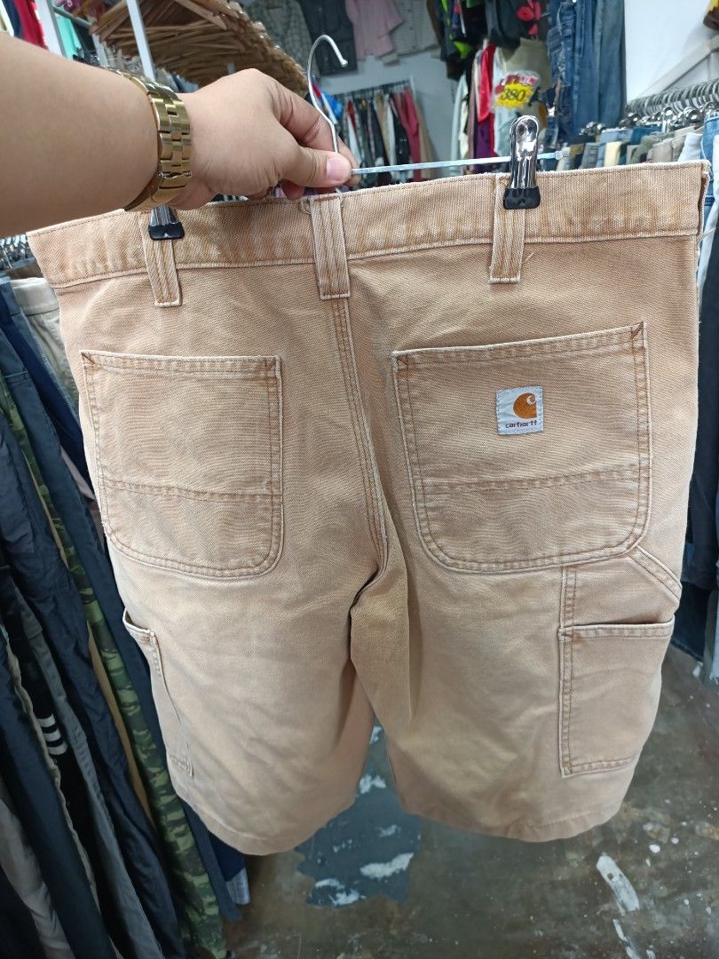 Carhartt Work in Progress Tan Duck Canvas Shorts (Category: Shorts) located in Bayombong. Submitted by rheaaa00530 (Listing ID 1468300876, Image 2). Description: - Brand: Carhartt - Material: Heavy-duty cotton canvas - Color: Tan - Features: Front slash pockets, belt loops, button waist with zipper fly - Condition: Classic workwear style with natural fading and minor wear spots - Best for: Outdoor work or casual everyday wear -size 35 via tape me