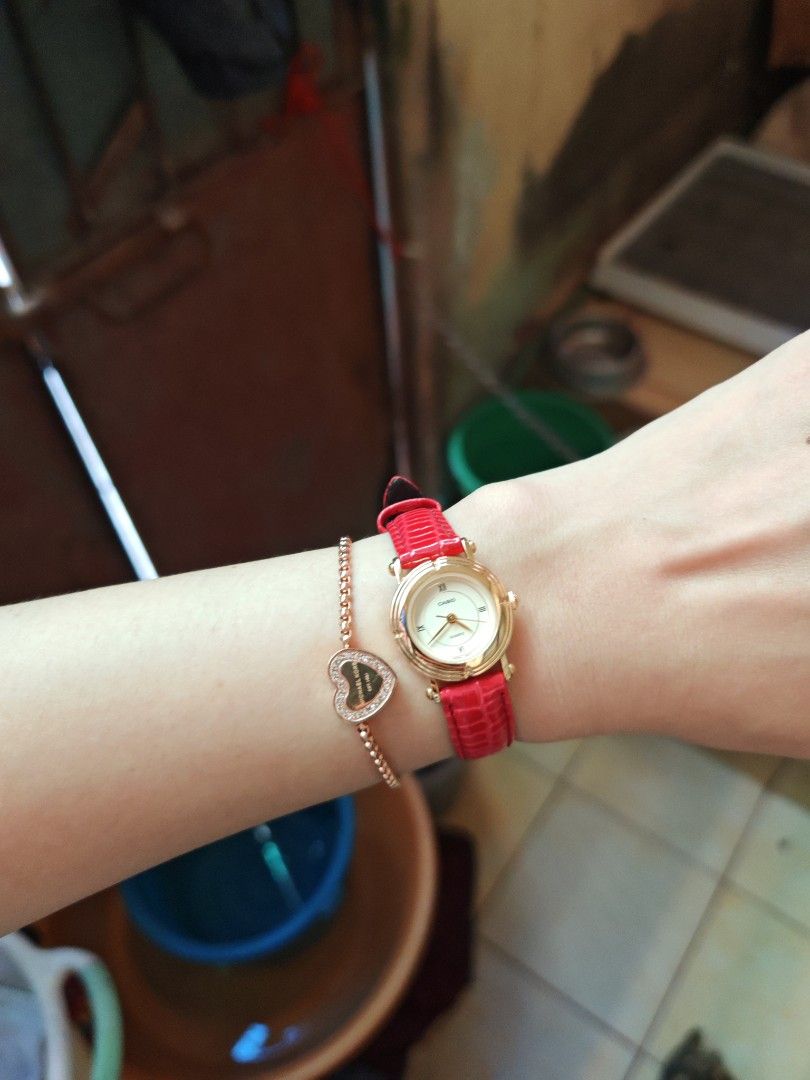Casio LTP-1106 Gold Watch (Category: Women's Watches) located in Taguig. Submitted by mystuff4youph (Listing ID 1468362479, Image 2). Description: - Brand: Casio women's watch - Design: Gold-tone case gold dial and Roman numerals (XII, IX, VI) - Replaced Strap: Bright red textured leather with standard buckle closure - Movement: Quartz movement, keeps time accurately - Build: Stainless steel back, water-resistant - Condition: Works great, like ne