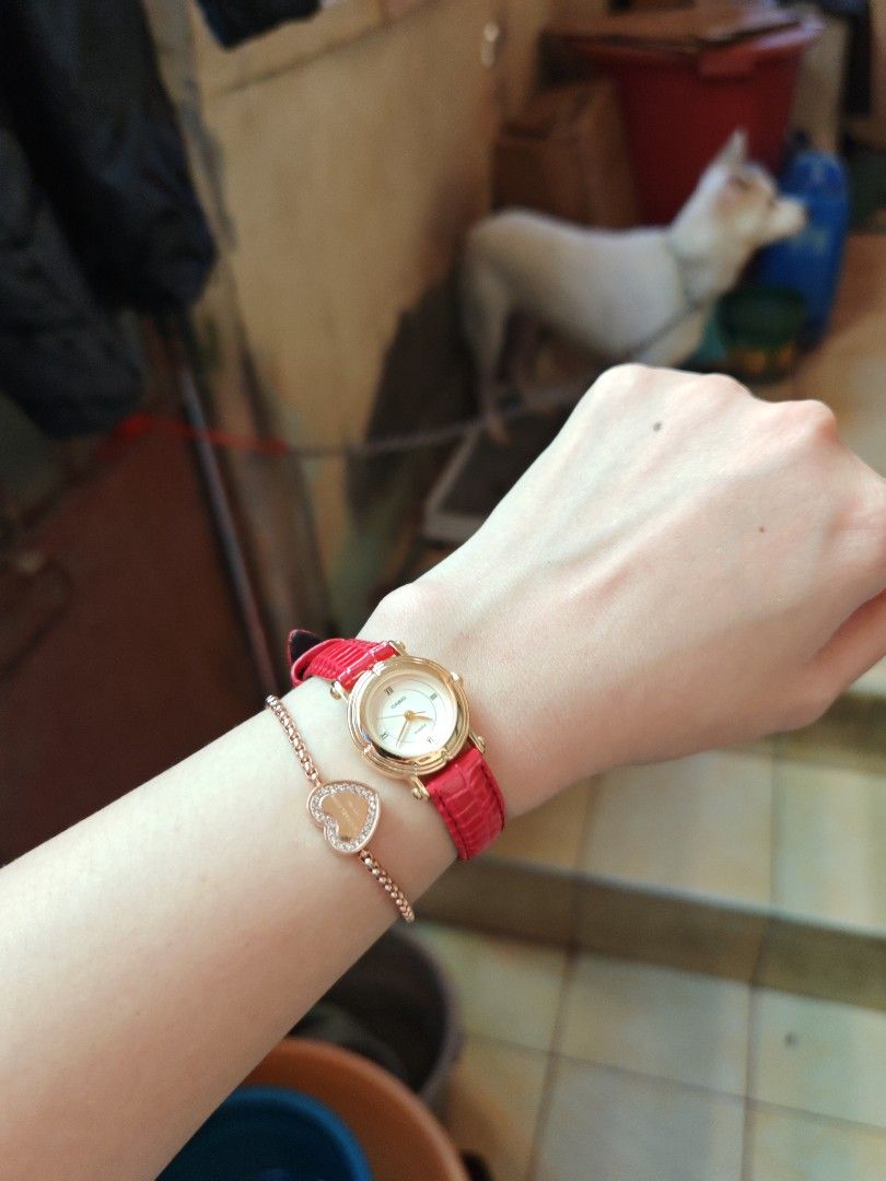 Casio LTP-1106 Gold Watch (Category: Women's Watches) located in Taguig. Submitted by mystuff4youph (Listing ID 1468362479, Image 3). Description: - Brand: Casio women's watch - Design: Gold-tone case gold dial and Roman numerals (XII, IX, VI) - Replaced Strap: Bright red textured leather with standard buckle closure - Movement: Quartz movement, keeps time accurately - Build: Stainless steel back, water-resistant - Condition: Works great, like ne