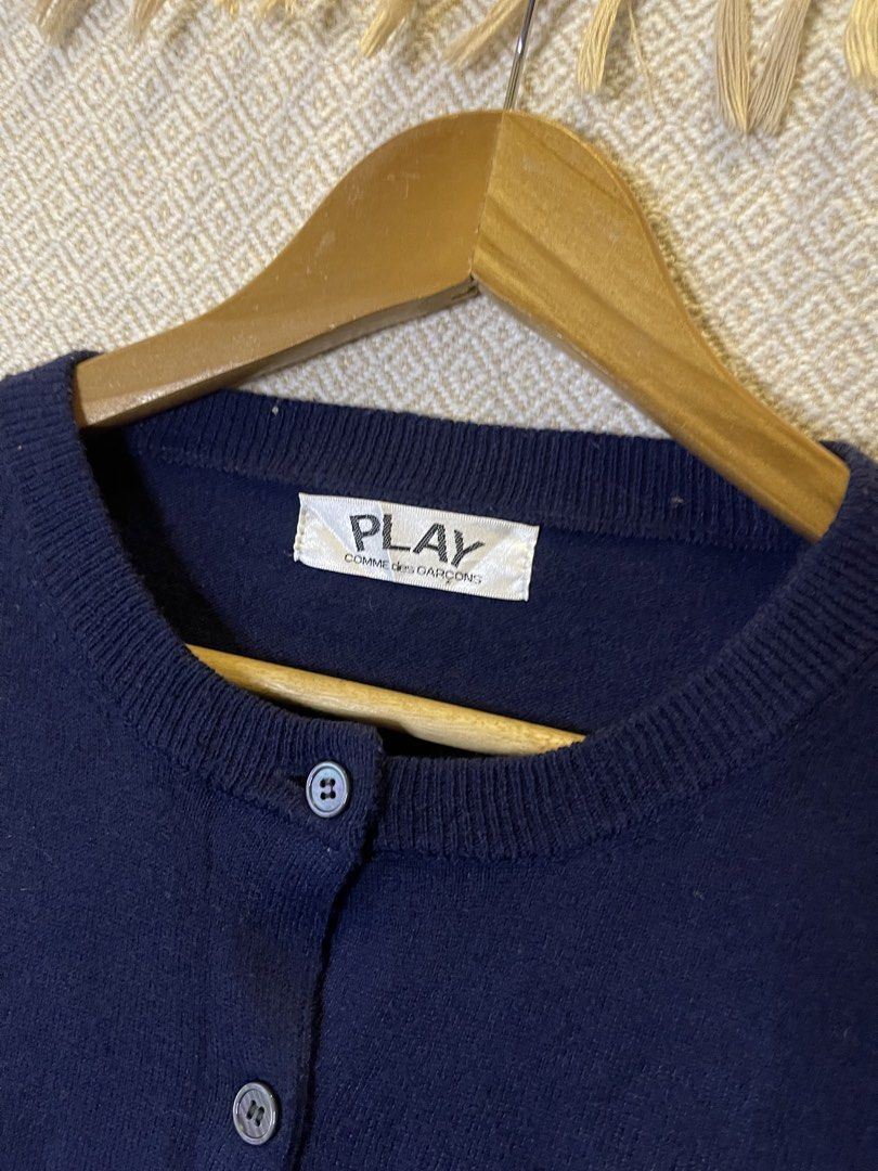 Cdg play navy blue cardigan (Category: Coats, Jackets and Outerwear) located in Manila. Submitted by hypestock_mnl (Listing ID 1468310644, Image 3). Description: - stylish - perfect for casual wear - great fit - in good condition - minimal signs of usage - 9/10 - money worth! - see pics for details/issue.