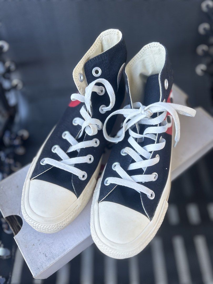 CDG Play x Converse Chuck Taylor High Top Black (Category: Sneakers) located in Quezon City. Submitted by cheriesonlineshop (Listing ID 1468462627, Image 2). Description: - Brand: Comme des Garçons Play x Converse - Style: Black High Top Sneakers - Design: Iconic red heart and eyes graphic on the side - Details: White rubber toe cap, contrast back seam stitching, and classic All Star branding. Needs cleaning Bought in Japan for ₱9500 - Inclusions