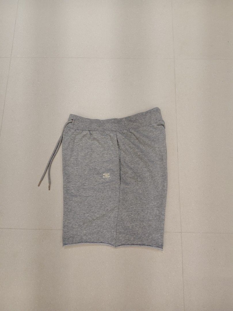Celine Grey Sweatshorts Size S (Category: Shorts) located in Manila. Submitted by christophe44164 (Listing ID 1468412842, Image 2). Description: Celine grey sweatshorts in size small. Features an elastic drawstring waistband and raw hem details. Small embroidered Celine logo on the front leg. Soft French terry cotton blend fabric inside. Side pockets included. Made with 86% cotton and 14% cashmere. Clean tags attached inside..