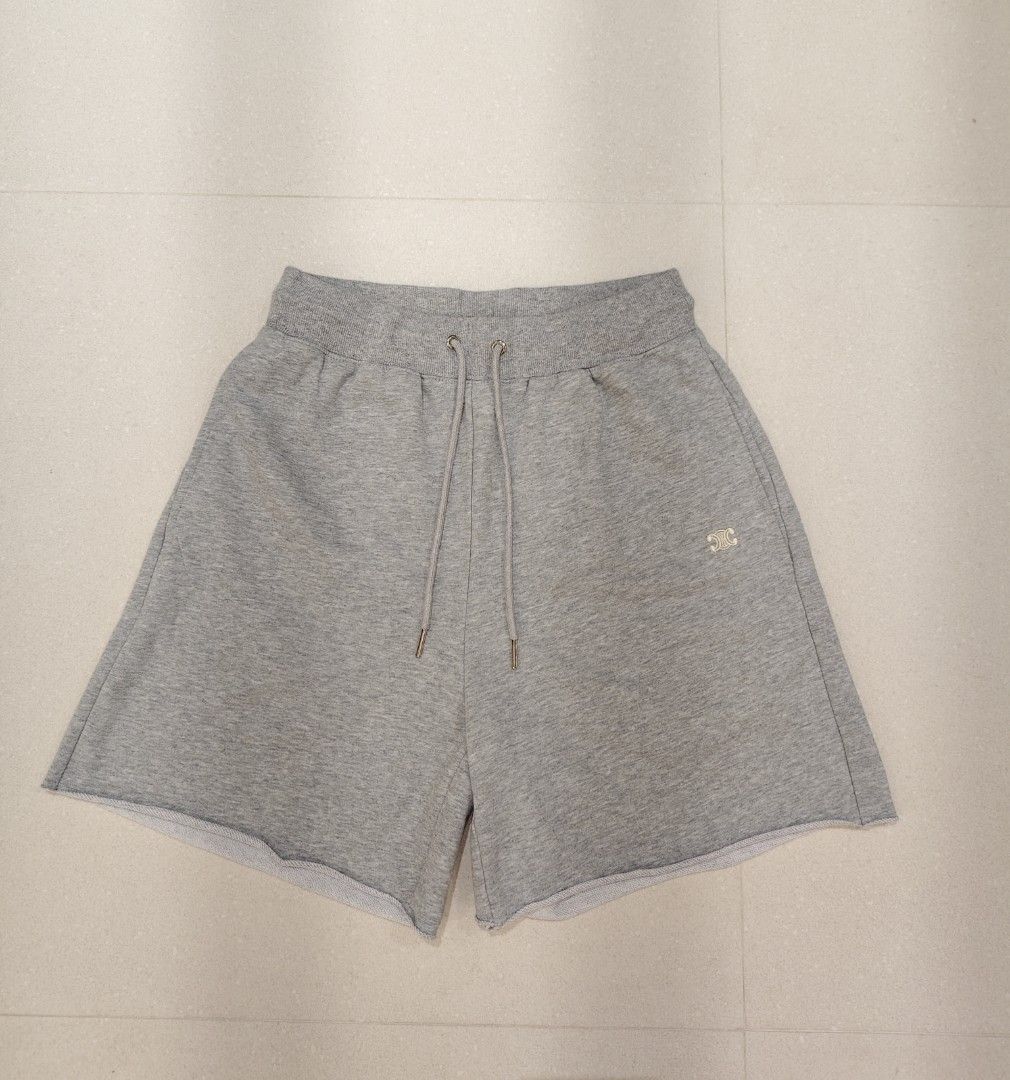 Celine Grey Sweatshorts Size S (Category: Shorts) located in Manila. Submitted by christophe44164 (Listing ID 1468412842, Image 1). Description: Celine grey sweatshorts in size small. Features an elastic drawstring waistband and raw hem details. Small embroidered Celine logo on the front leg. Soft French terry cotton blend fabric inside. Side pockets included. Made with 86% cotton and 14% cashmere. Clean tags attached inside..