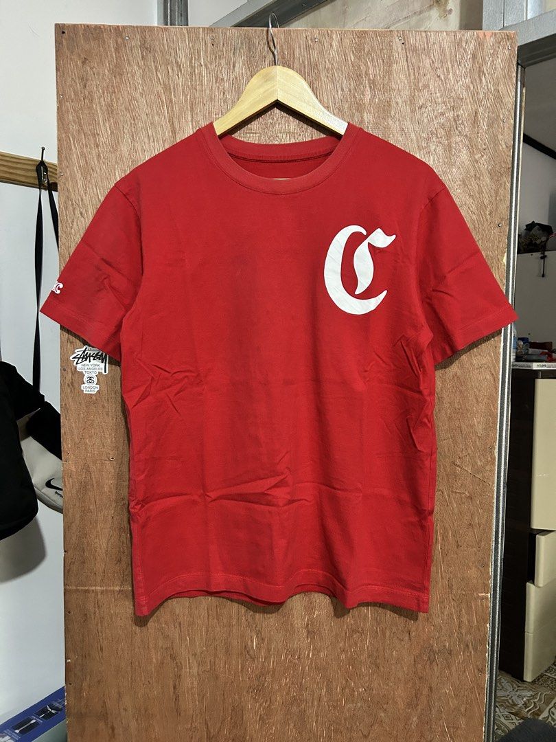 Celine Red T-shirt (Category: Shirts) located in Davao. Submitted by orbetaarch23339 (Listing ID 1468422063, Image 2). Description: - Brand: Celine - Color: Red - Size: S - Material: 100% Cotton (Made in Portugal) - Design: White gothic C logo on chest, large Celine text on back - Condition: Clean overall with flawless prints - Care: Hand wash with cold water only.