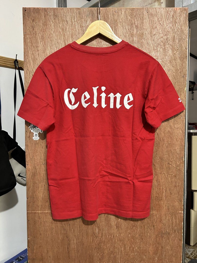 Celine Red T-shirt (Category: Shirts) located in Davao. Submitted by orbetaarch23339 (Listing ID 1468422063, Image 1). Description: - Brand: Celine - Color: Red - Size: S - Material: 100% Cotton (Made in Portugal) - Design: White gothic C logo on chest, large Celine text on back - Condition: Clean overall with flawless prints - Care: Hand wash with cold water only.