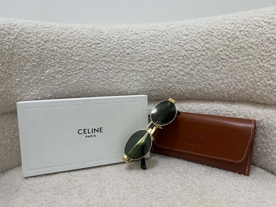 Celine Triomphe Metal Sunglasses (Category: Sunglasses & Eyewear) located in Paoay. Submitted by rvf1230 (Listing ID 1468364377, Image 2). Description: - Brand: Celine - Frame: Gold metal finish with tortoiseshell acetate temple tips - Lenses: Dark green - Details: Iconic Triomphe logo hardware on temples - Inclusions: Original tan leather case and white Celine box - Condition: Like New / Pristine.