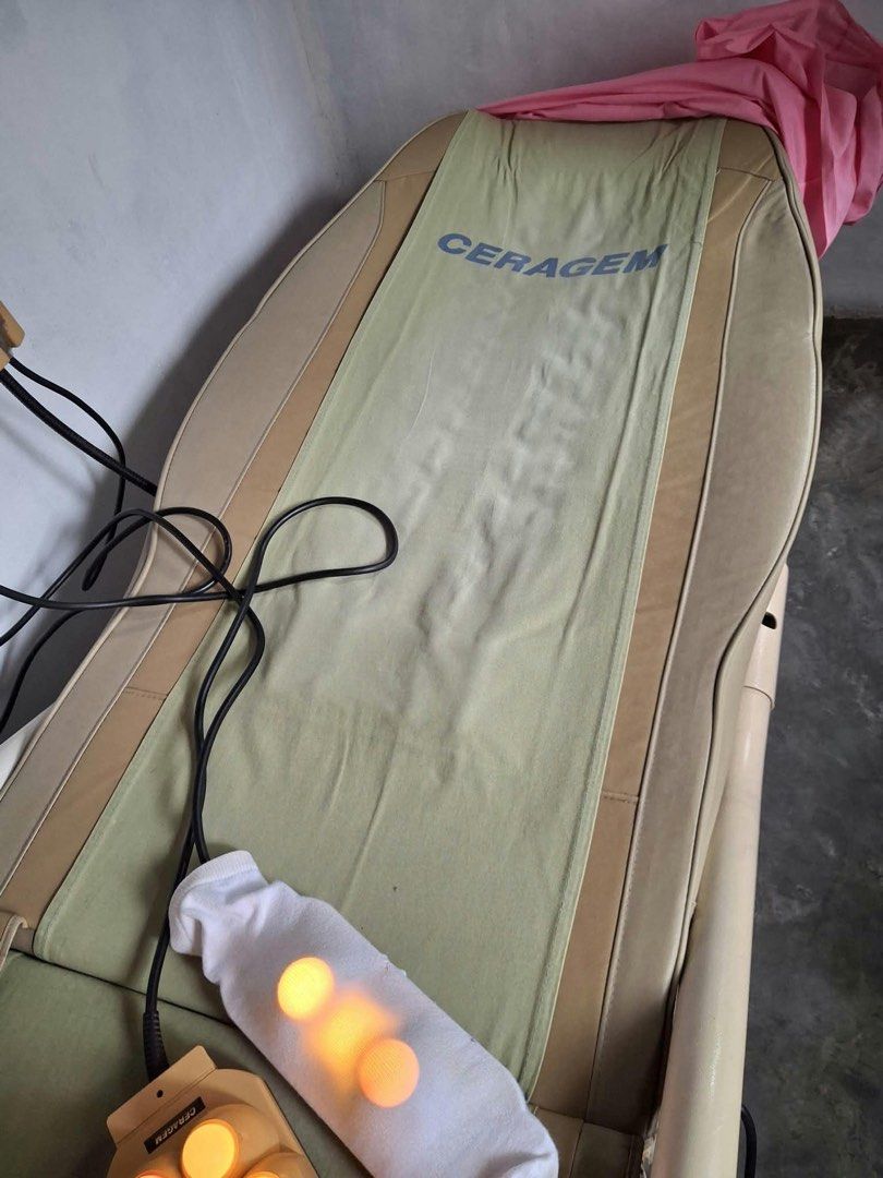 Ceragem Thermal Massage Bed with External Projectors (Category: Massage Devices) located in Manila. Submitted by kristiamac (Listing ID 1468466134, Image 2). Description: - Authentic Ceragem thermal massage bed in beige and green fabric - Includes external 9-sphere and 3-sphere light therapy projectors with fully functioning glowing bulbs - Equipped with a side-attached wired control panel and power connections - Shows normal, expected wear on th