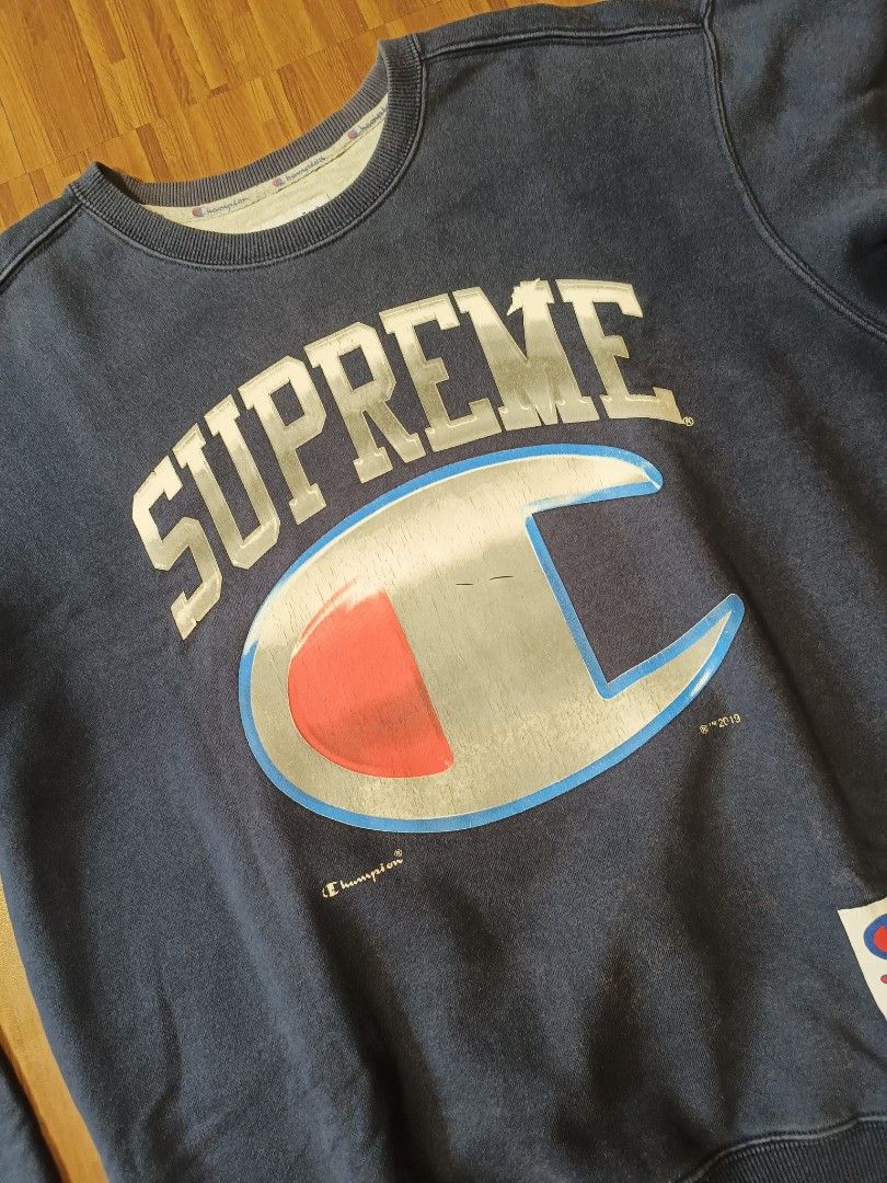 Champion Crewneck Sweatshirt (Category: Coats, Jackets and Outerwear) located in Cavite. Submitted by south.loot (Listing ID 1468336456, Image 3). Description: Champion x Supreme Crewneck Size Small Length 26.5 Width 23 Color rate 8.5/10 Crackprints Good to excellent condition.