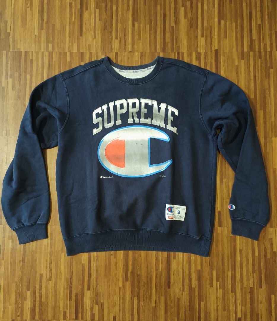 Champion Crewneck Sweatshirt (Category: Coats, Jackets and Outerwear) located in Cavite. Submitted by south.loot (Listing ID 1468336456, Image 1). Description: Champion x Supreme Crewneck Size Small Length 26.5 Width 23 Color rate 8.5/10 Crackprints Good to excellent condition.