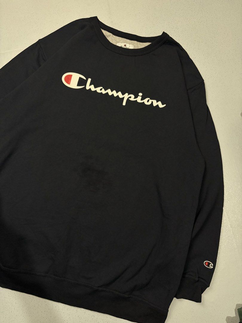 Champion Dark Navy Script Logo Crewneck Sweatshirt (Category: Coats, Jackets and Outerwear) located in Cainta. Submitted by rizalthriftstuff (Listing ID 1468368756, Image 2). Description: Champ Script Navy Blue Dimes Size: 3XL Tall Width: 28 Length: 34 Color Rate: 9 Condition: 8 Issue: Oil Stain Mine - ₱400 - Brand/Style: Champion crewneck sweatshirt - Color: Dark navy with large cream script logo - Details: Classic embroidered C logo patch on le