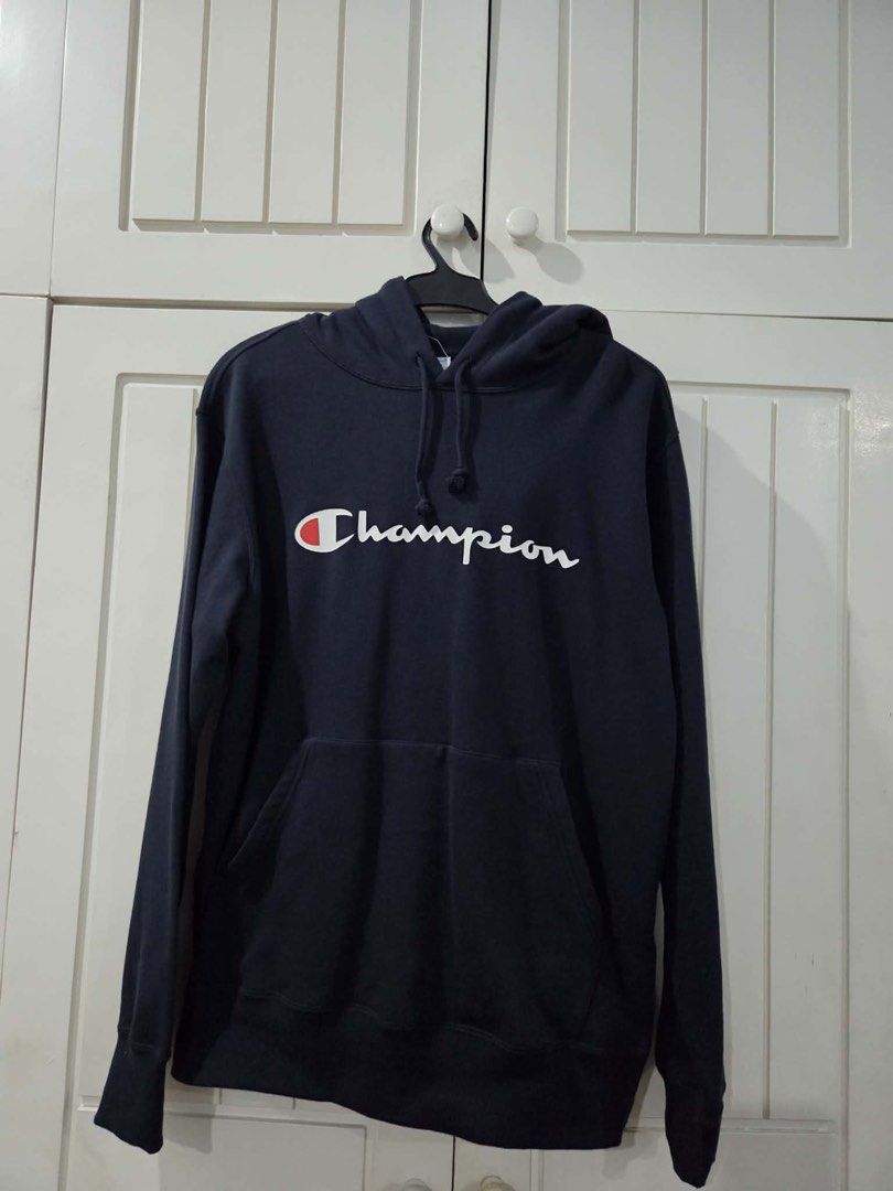 Champion Navy Blue Script Logo Hoodie (Category: Coats, Jackets and Outerwear) located in Muntinlupa City. Submitted by booterin0 (Listing ID 1468356836, Image 1). Description: Authentic Champion logo navy blue hoodie Size: XL (men’s) Condition: brand new; never used. Price: ₱1,490 (negotiable + can bundle with other items) RFS: decluttering Payment via GCash or bank transfer. Delivery shouldered by buyer 💌 Message me if interested!.