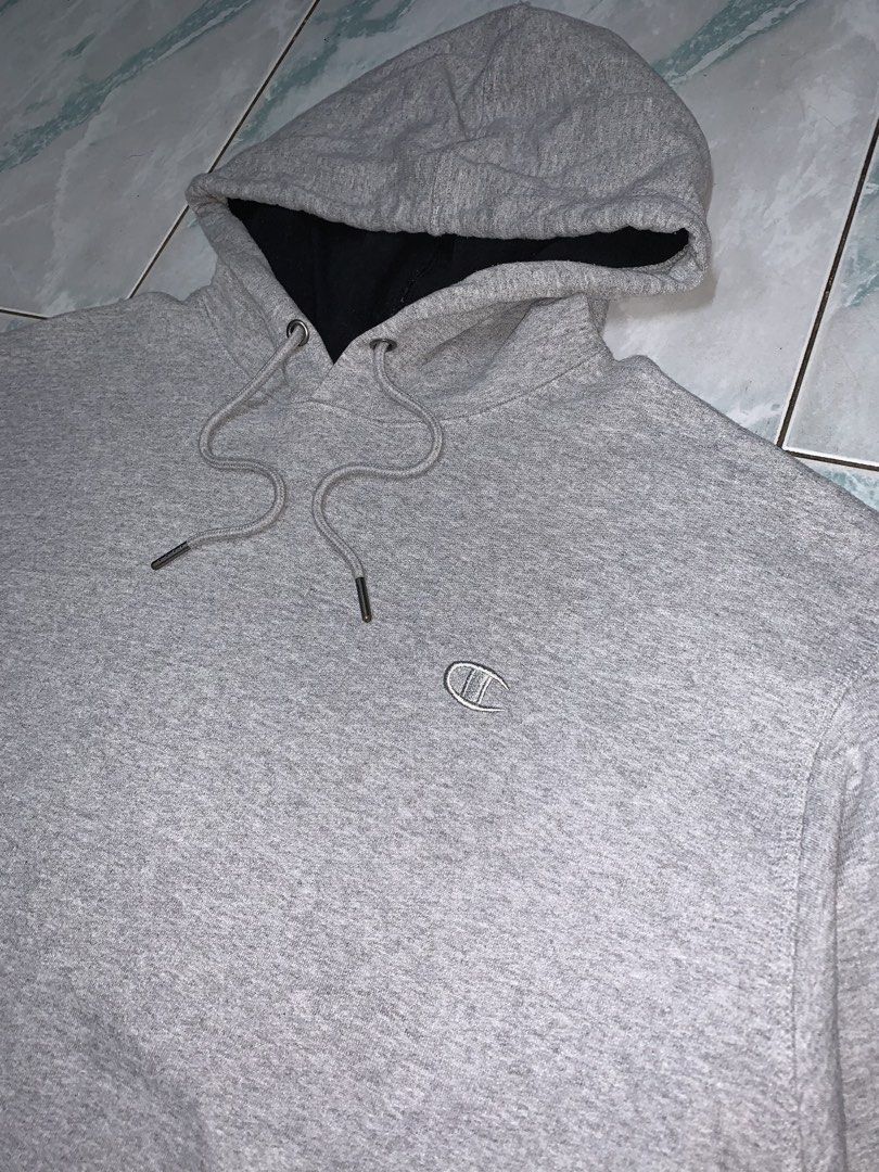 Champion pullover hoodie (Category: Hoodies) located in Pasig City. Submitted by thriftnflip1600 (Listing ID 1468461762, Image 2). Description: XL on tag Width: 25.5” Length: 29.5” Color rate: 9/10 Condition: 9/10 No issues.
