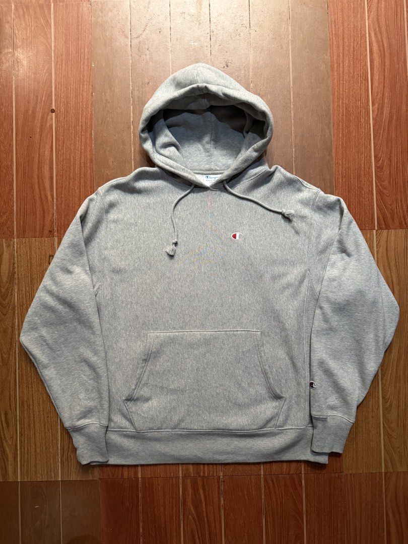 Champion Reverse Weave Grey Hoodie (Category: Hoodies) located in Dasmarinas. Submitted by kylebecker (Listing ID 1468312330, Image 1). Description: - Authentic Champion Reverse Weave hoodie - Color: Light grey - Heavyweight cotton blend for maximum warmth and durability - Small embroidered logo on chest and signature patch on left cuff - Classic kangaroo front pocket and drawstring hood - Ribbed side panels for added stretch and mobility - Stand