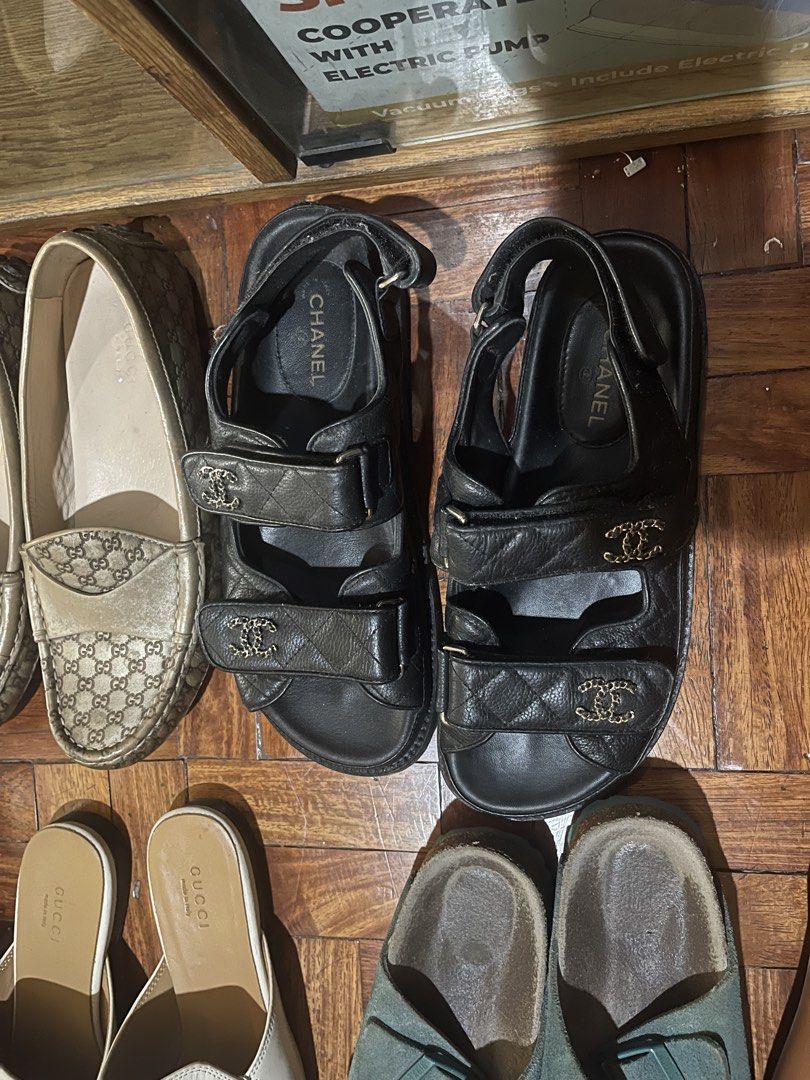 Chanel Black Quilted Leather Dad Sandals (Category: Sneakers & Footwear) located in Manila. Submitted by evelyngrac95466 (Listing ID 1468324661, Image 1). Description: - Brand: Chanel - Style: Dad sandals / double strap - Material: Premium black quilted leather - Closures: Adjustable velcro straps - Hardware: Gold-tone interlocking CC charms - Sole: Chunky black sole with embossed Chanel logo - Fit: Comfortable flat style, ideal for daily wear - 