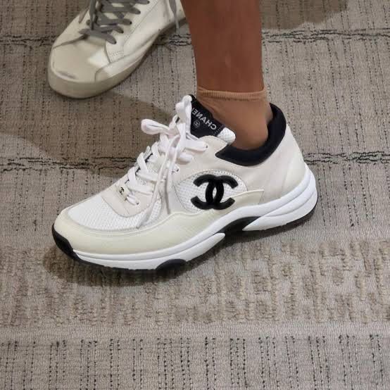 CHANEL CC Logo Sneakers (Category: Sneakers) located in Quezon City. Submitted by kellypochette (Listing ID 1468407271, Image 3). Description: CHANEL CC Logo Sneakers | White & Black Leather, Suede & Mesh | 100% Authentic A gorgeous pair of CHANEL CC Logo Sneakers in a timeless white and black colorway. Featuring the iconic black interlocking CC logo, these sneakers combine CHANEL’s signature Parisian elegance with a sporty, contemporary silhouet