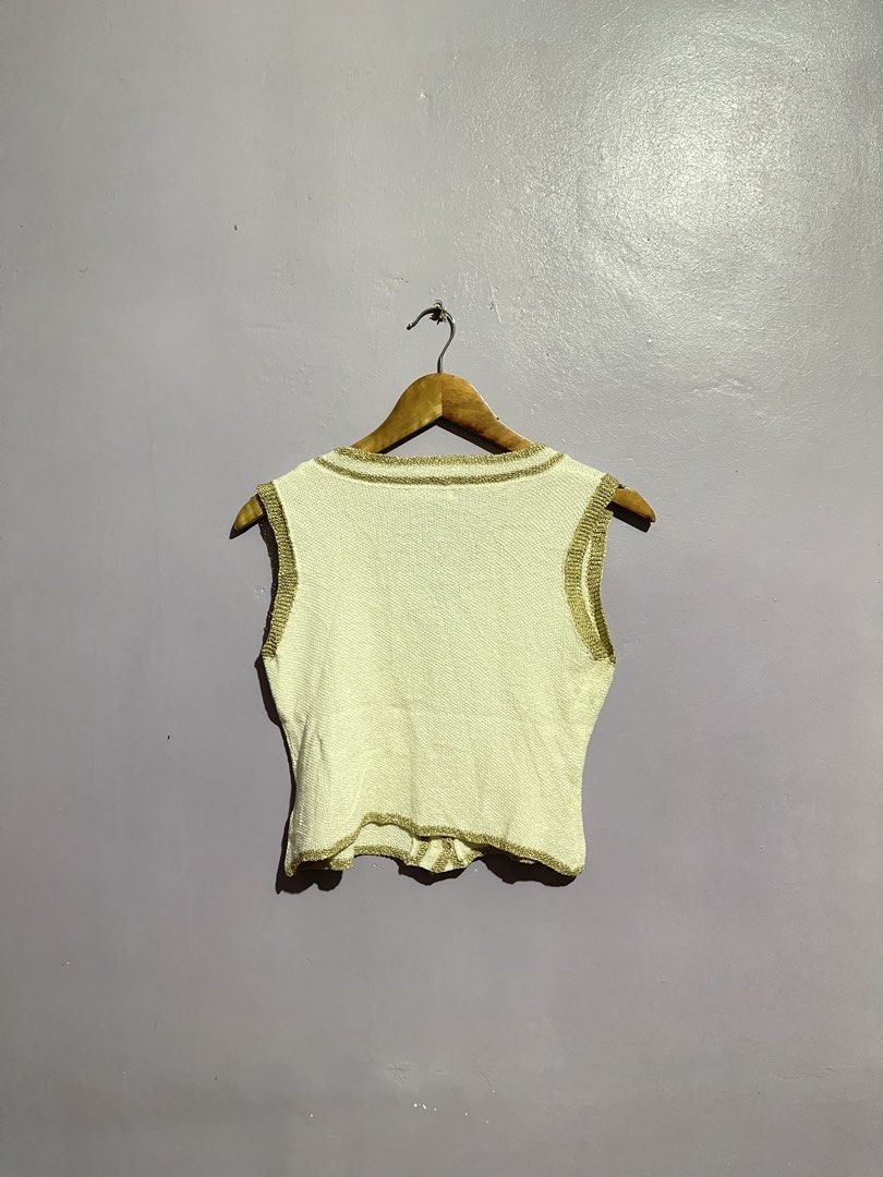 Chanel Gold Design Sleeveless Top (Category: Sleeveless) located in Angeles City. Submitted by andreiboughts (Listing ID 1468416559, Image 2). Description: Length: 17 Width: 15 Condition: 10/10 Color rate: 10/10 Issue (s): removable stain Part of Hangtag is still intact Complete Tags ✅.