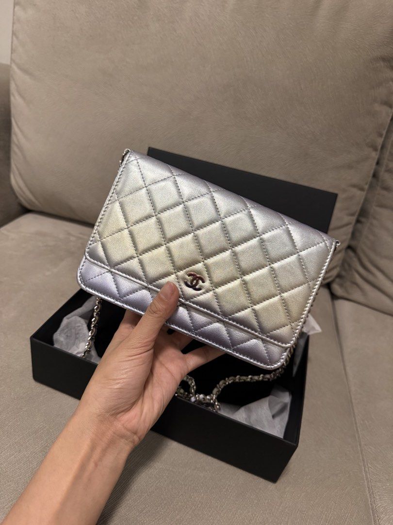 Chanel Wallet On Chain Bag (Category: Luxury Bags & Wallets) located in Taguig. Submitted by byebyebabies (Listing ID 1468301784, Image 1). Description: - Brand: Chanel - Style: Wallet on Chain (WOC) - Finish: Stunning metallic iridescent gradient (shifts between silver, purple, and gold tones) - Design: Classic diamond quilting with iconic interlocked CC logo on front flap - Strap: Leather-interwoven chain strap - Inclusions: Comes with original
