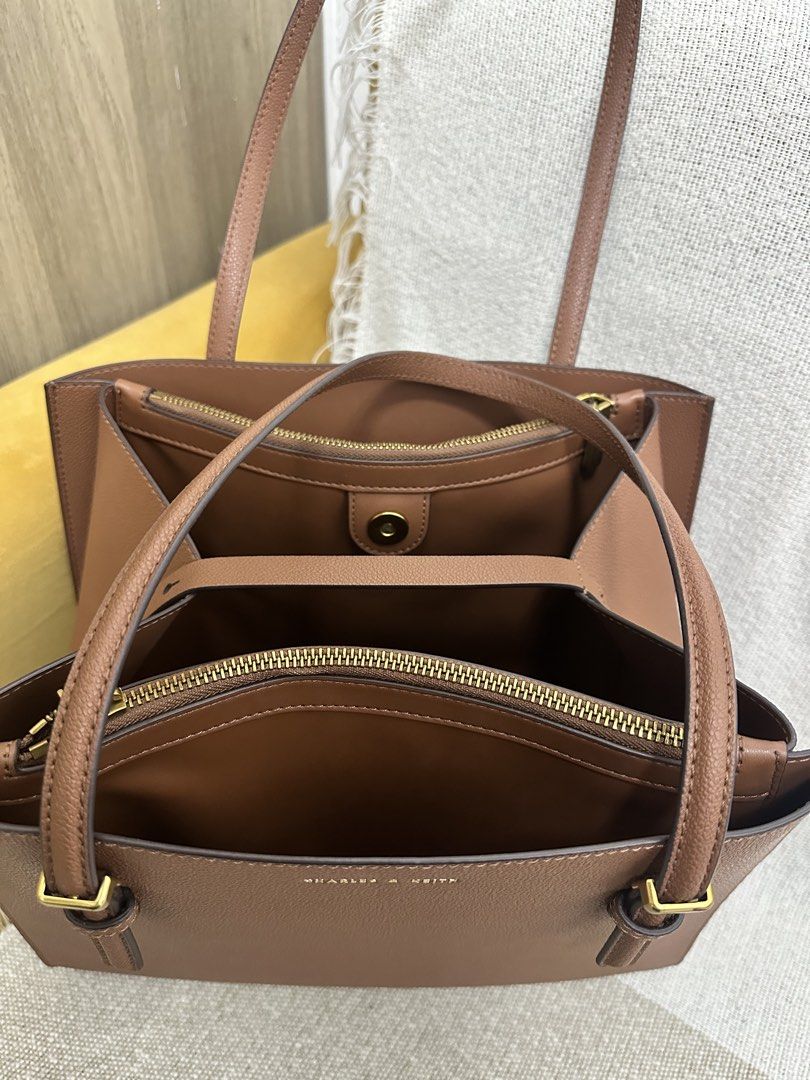 Charles & Keith Bag (Category: Shoulder Bags) located in Mandaluyong City. Submitted by kaycee_0821 (Listing ID 1468413420, Image 3). Description: Height - 29 cm Width - 33 cm Tyoe of closure - Magnetic Depth - 12 cm Strap - Non - detachable.