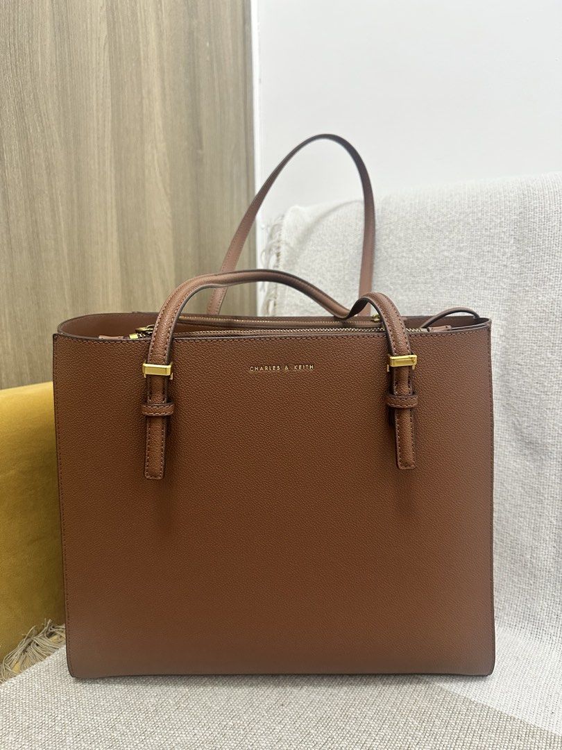 Charles & Keith Bag (Category: Shoulder Bags) located in Mandaluyong City. Submitted by kaycee_0821 (Listing ID 1468413420, Image 1). Description: Height - 29 cm Width - 33 cm Tyoe of closure - Magnetic Depth - 12 cm Strap - Non - detachable.
