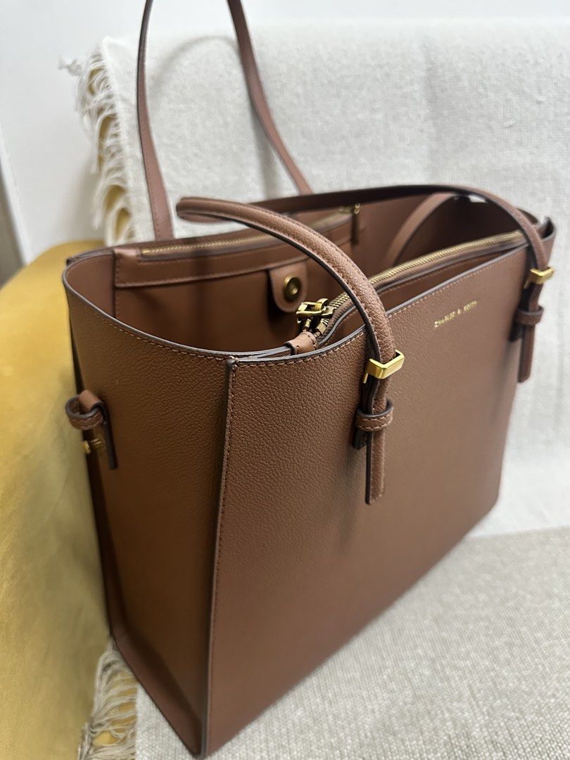 Charles & Keith Bag (Category: Shoulder Bags) located in Mandaluyong City. Submitted by kaycee_0821 (Listing ID 1468413420, Image 2). Description: Height - 29 cm Width - 33 cm Tyoe of closure - Magnetic Depth - 12 cm Strap - Non - detachable.