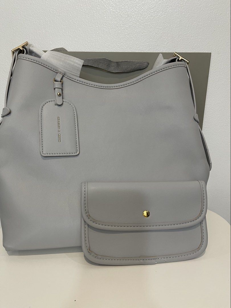 Charles & Keith Tote Bag with pouch (Category: Tote Bags) located in Pasig City. Submitted by preloved.closet2 (Listing ID 1468314026, Image 1). Description: 1 pc only Color Grey with Zipper With pouch .