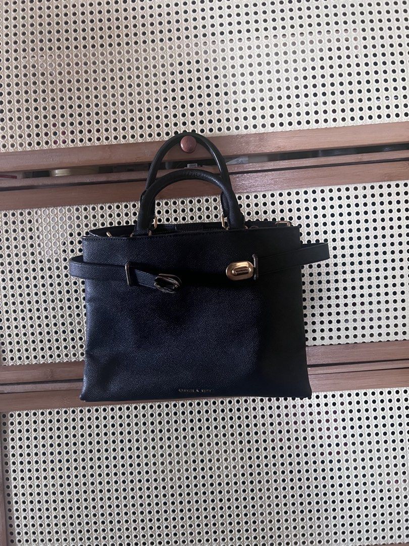 Charles & Keith Turn-Lock Tote Bag (Category: Shoulder Bags) located in Mandaluyong City. Submitted by jillylilly (Listing ID 1468340463, Image 3). Description: Best for petite women. Small enough to not look bulky. Big enough to fit a tablet. Perfect for night outs. Made with sturdy black leather. Structured enough to stand on its own. .