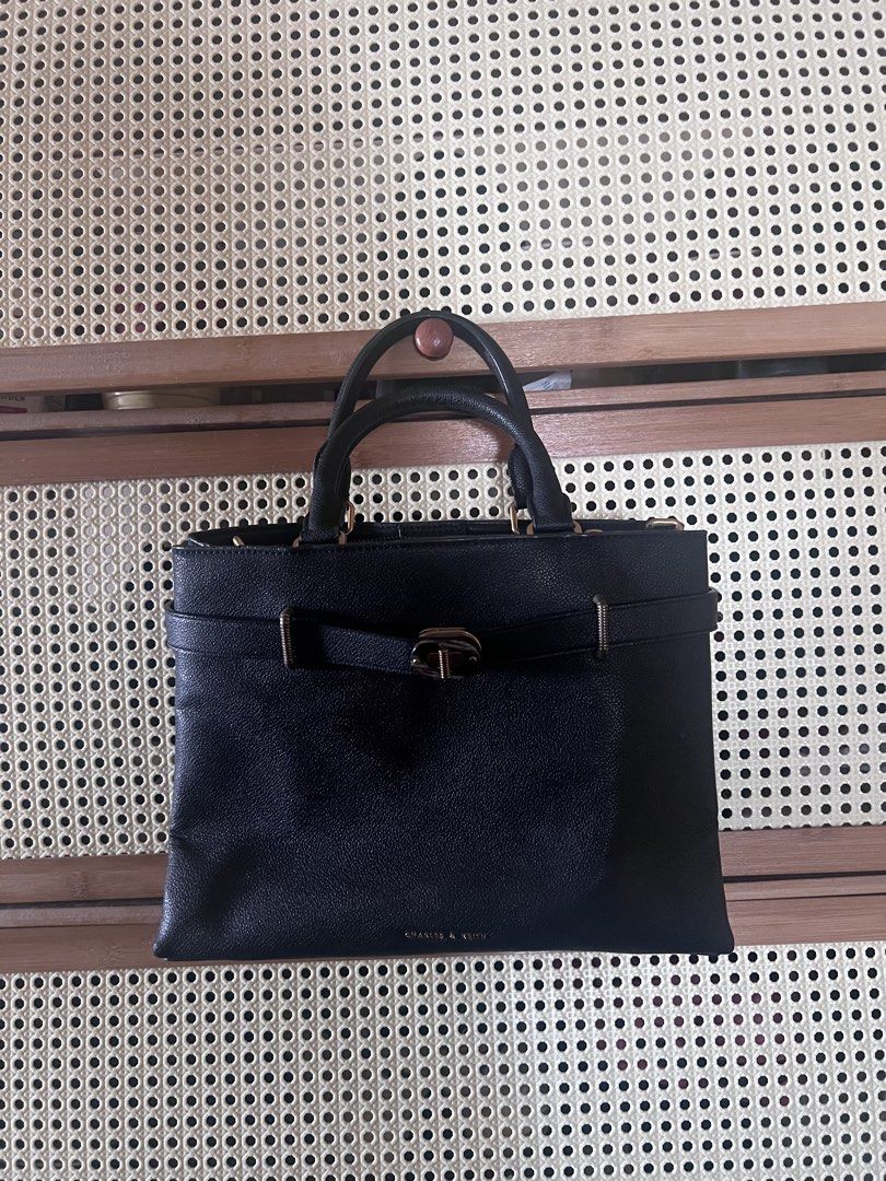 Charles & Keith Turn-Lock Tote Bag (Category: Shoulder Bags) located in Mandaluyong City. Submitted by jillylilly (Listing ID 1468340463, Image 2). Description: Best for petite women. Small enough to not look bulky. Big enough to fit a tablet. Perfect for night outs. Made with sturdy black leather. Structured enough to stand on its own. .