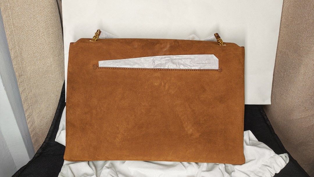 Charles & Keith Two-Tone Suede Shoulder Bag (Category: Shoulder Bags) located in Manila. Submitted by chubbychic553 (Listing ID 1468295751, Image 3). Description: - Stylish brown suede flap with a clean white base - Elegant gold-tone chain strap and hardware - Secure zip top closure under the main flap - Fully lined brown fabric interior - Includes back slip pocket - Comes with original dust bag Php 5000.