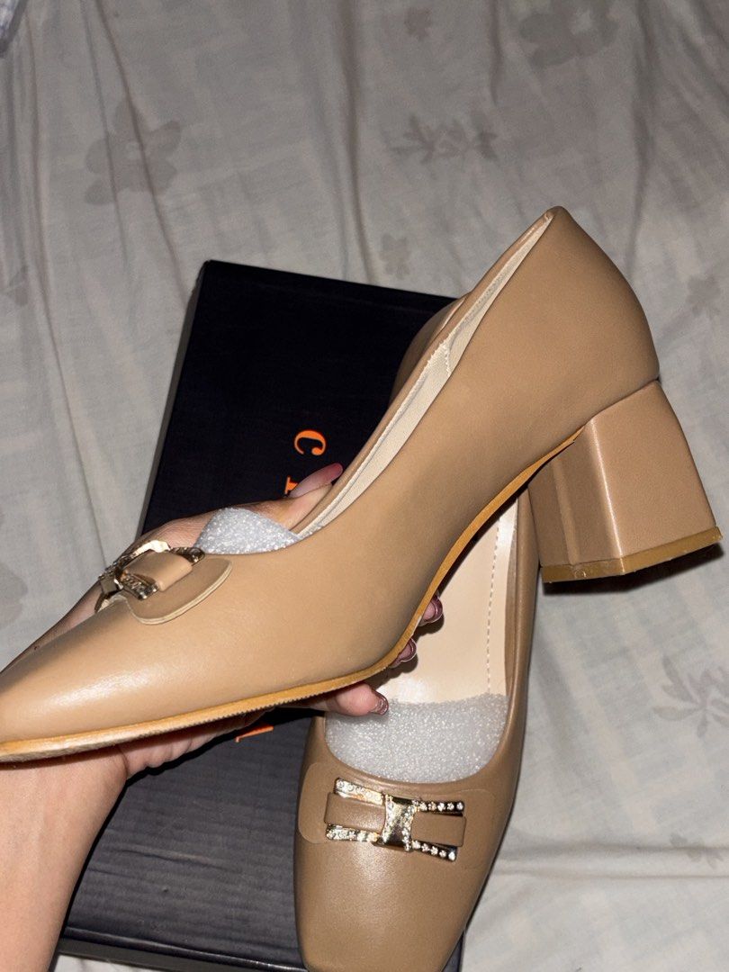 Chesca Block Heel Pumps Size 37 Nude (Category: Heels) located in Manila. Submitted by ernndlcrzl72179 (Listing ID 1468351280, Image 3). Description: Chesca block heel pumps in nude beige. Size 37. Square toe design with rhinestone embellished bow detail on the front. Chunky block heel for comfortable walking. Original shoe box included inside. Packing foam still stuffed inside the shoes. Clean insoles and pristine outer material. Wore it once, I