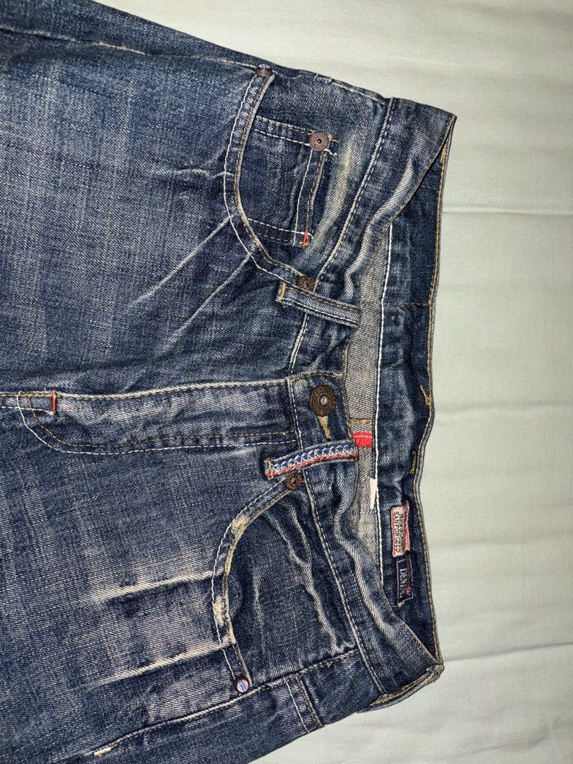 Chevignon Natural Denim Sanforized Jeans Size 29 (Category: Jeans) located in Manila. Submitted by silverjubilee (Listing ID 1468334363, Image 2). Description: - Brand: Chevignon - Size: 29 (tag inside) - Color/Wash: Dark wash denim with vintage faded finish - Material: 100% cotton - Fit: Classic straight cut - Closure: Button fly with branded hardware - Special Details: Red contrast stitching on pockets and waistband, natural sanforized denim li
