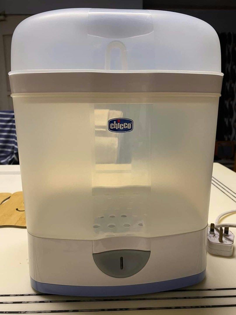Chicco Baby Bottle Steriliser (Category: Breastfeeding & Bottle Feeding) located in Quezon City. Submitted by ninsamisola (Listing ID 1468314839, Image 1). Description: - Authentic Chicco electric bottle steriliser - Sleek white and translucent plastic body with a compact countertop footprint - Tall lid keeps baby feeding gear fully covered during the sterilising cycle - Clean interior featuring steaming holes at the base - Convenient front power