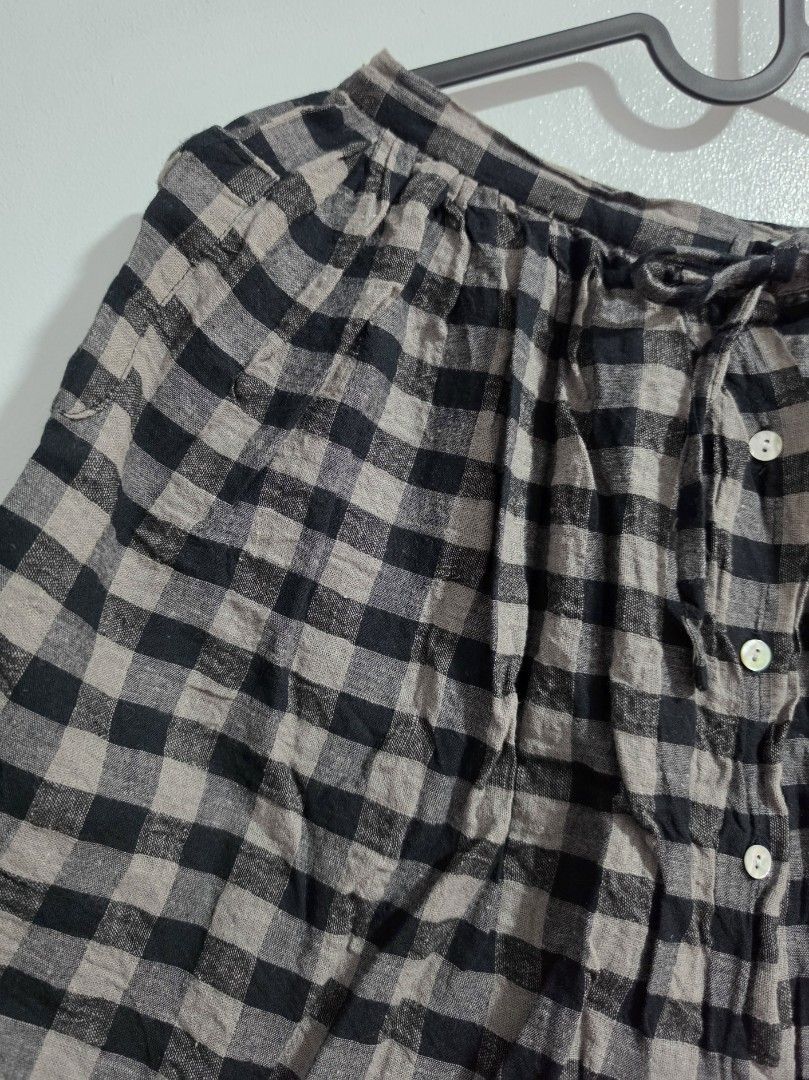 Childsibel Black and Grey Gingham Skirt Size 120 (Category: Skirts) located in Paranaque City. Submitted by franinnashop (Listing ID 1468360708, Image 3). Description: Declutter - Brand: Childsibel - Size: 120 (Tag size) - Design: Black and grey gingham plaid - Waist: functional front drawstring tie - Closure: Front button-down with 4 white buttons - Measurements: ~24 inches waist, ~16 inches length - Fabric: Lightweight and comfortable - Conditi
