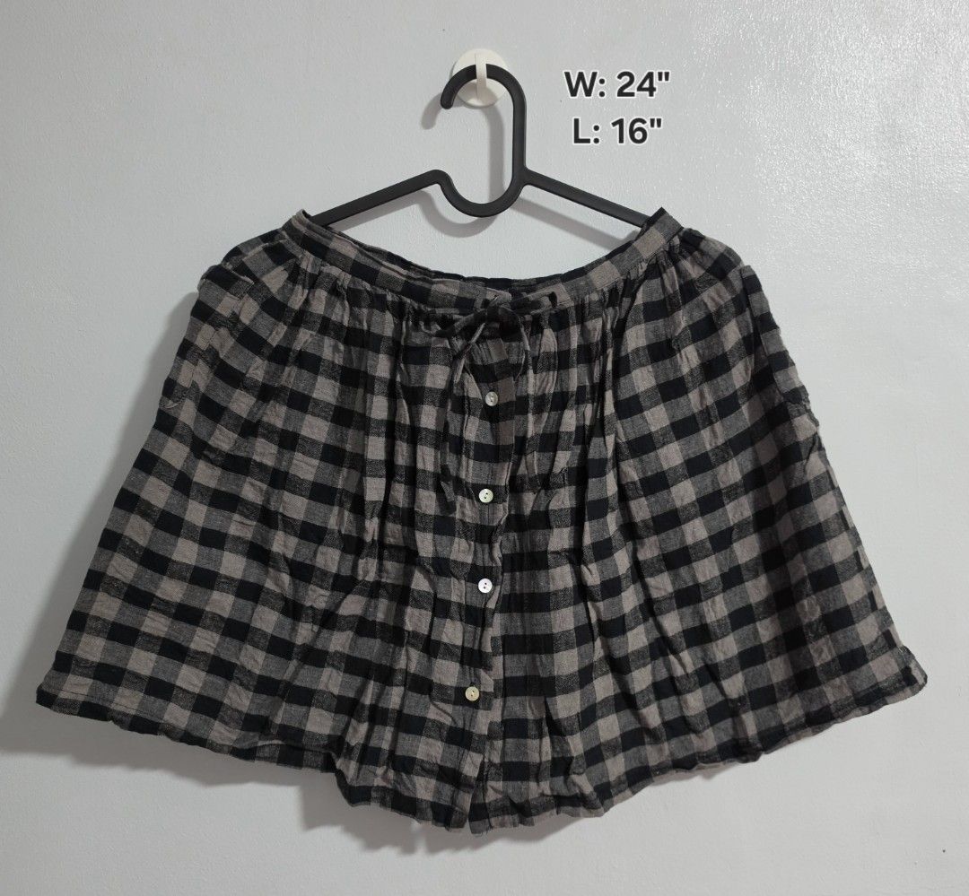 Childsibel Black and Grey Gingham Skirt Size 120 (Category: Skirts) located in Paranaque City. Submitted by franinnashop (Listing ID 1468360708, Image 1). Description: Declutter - Brand: Childsibel - Size: 120 (Tag size) - Design: Black and grey gingham plaid - Waist: functional front drawstring tie - Closure: Front button-down with 4 white buttons - Measurements: ~24 inches waist, ~16 inches length - Fabric: Lightweight and comfortable - Conditi