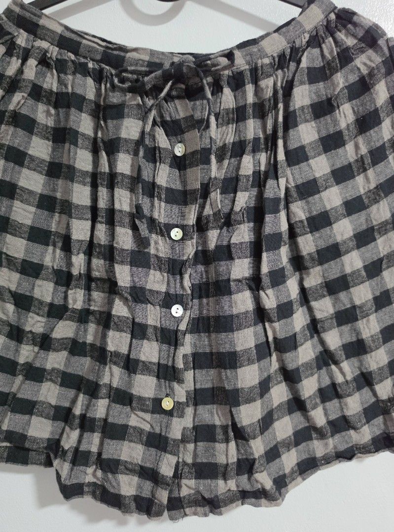 Childsibel Black and Grey Gingham Skirt Size 120 (Category: Skirts) located in Paranaque City. Submitted by franinnashop (Listing ID 1468360708, Image 2). Description: Declutter - Brand: Childsibel - Size: 120 (Tag size) - Design: Black and grey gingham plaid - Waist: functional front drawstring tie - Closure: Front button-down with 4 white buttons - Measurements: ~24 inches waist, ~16 inches length - Fabric: Lightweight and comfortable - Conditi