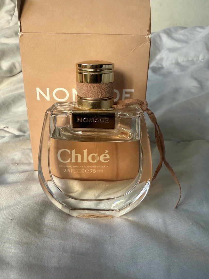 Chloé Nomade Eau de Parfum 75ml (Category: Fragrance & Deodorants) located in Batangas. Submitted by gaprelovedthings (Listing ID 1468359999, Image 3). Description: - Authentic Chloé Nomade Eau de Parfum - Size: 75ml (Natural Spray / Vaporisateur) - Condition: Mostly full, only sprayed a few times - Packaging: Comes with original box (minor shelf wear on top flap) - Fragrance Profile: Fresh, woody floral with oakmoss and plum notes - Perfect as a