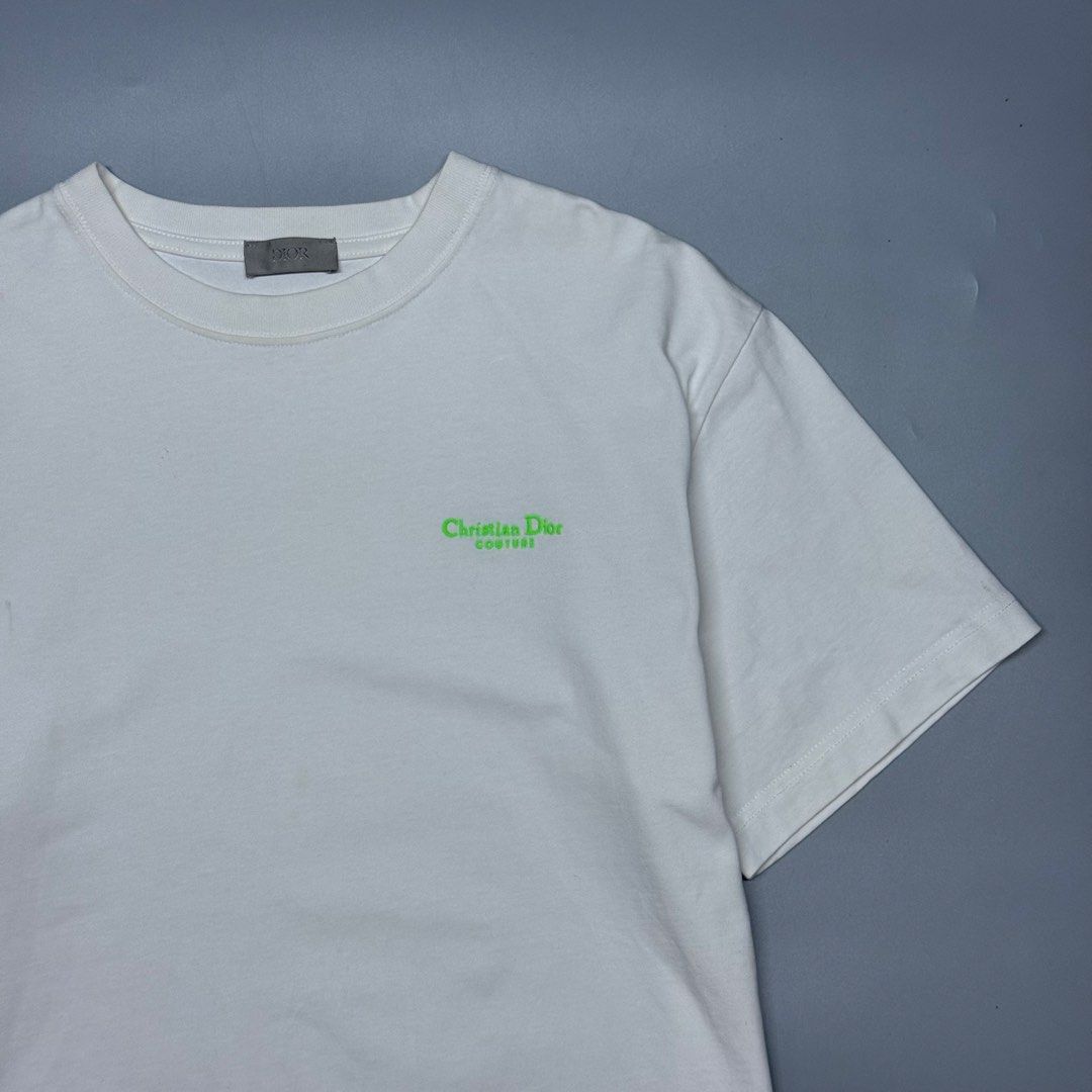Christian Dior Couture Embroidered Logo (Category: Luxury Apparel) located in Kabacan. Submitted by rags2penny.phl (Listing ID 1468335862, Image 2). Description: - Dior short sleeve t-shirt in crisp white - Features a subtle neon green Christian Dior Couture embroidery on the chest - Classic ribbed crewneck collar with signature grey Dior neck tag - Clean solid cotton body with a straight hem - Premium designer casual wear - Condition: Brand new 